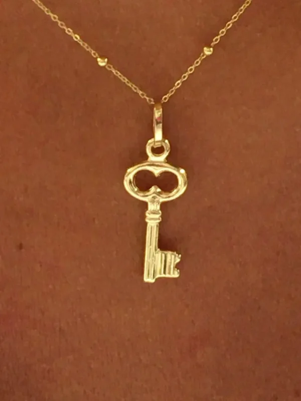 Roman Joyero Colgantes<Colgante con un motivo llave AFRA en oro amarillo 18 Kilates.