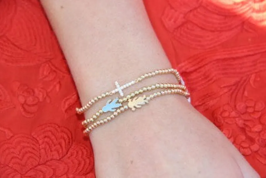 cronos_pulsera_de_plata_d_2.webp Roman Joyero Pulseras<CRONOS, pulsera de plata dorada con niño