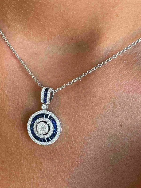 Roman Joyero Colgantes<DRAKE colgante forma redonda en oro brillantes y zafiros o rubies