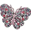 Roman Joyero Acero<MALEFICA, broche en acero en forma de mariposa y circonitas.