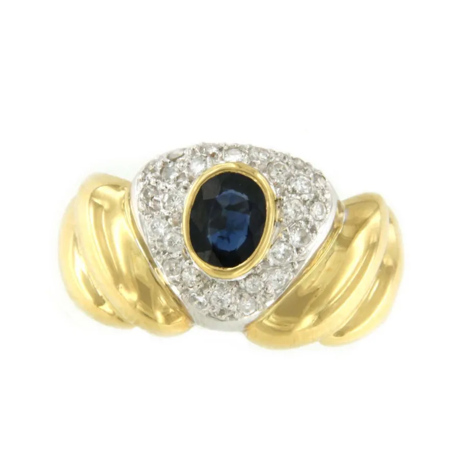 sortija_twilight_en_oro_b_0.webp Roman Joyero Anillos<Sortija TWILIGHT en oro blanco y amarillo con un zafiro central